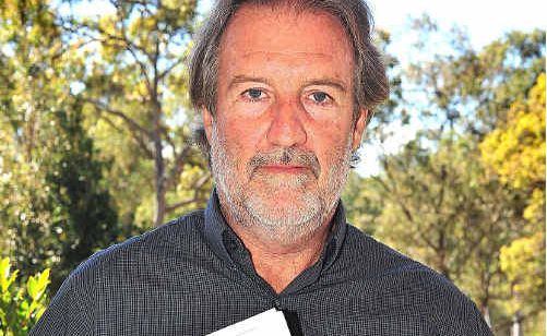 Ralph Hess holds a police letter. Ralph Hess holds a police letter.